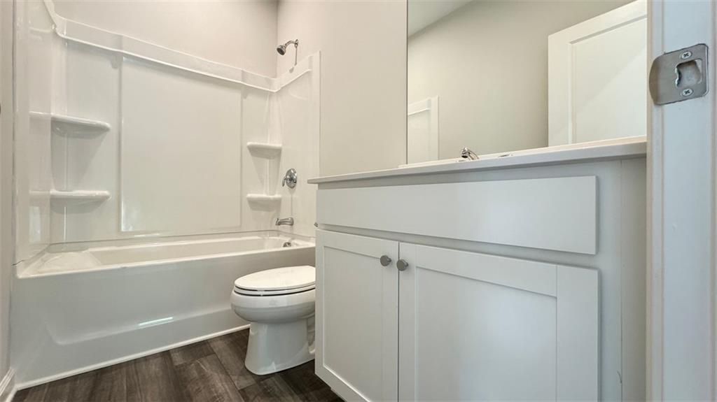 1479 Creekside Circle Northwest Atlanta, GA 30318 - Photo 20 of 42 a bathroom with a sink a toilet and shower