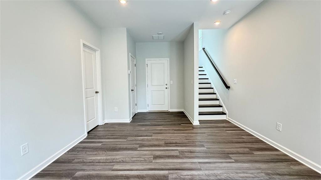 1479 Creekside Circle Northwest Atlanta, GA 30318 - Photo 27 of 42 a view of a hallway with wooden floor and staircase