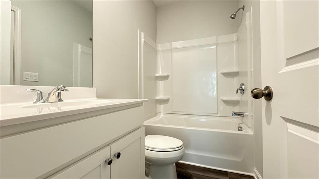 1479 Creekside Circle Northwest Atlanta, GA 30318 - Photo 30 of 42 a bathroom with a sink a toilet and a bathtub