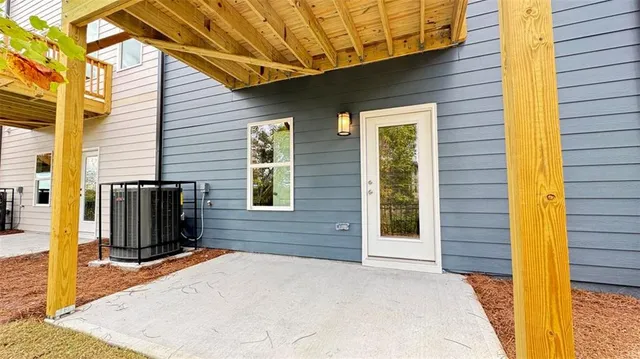 a view of a brick house with a yard