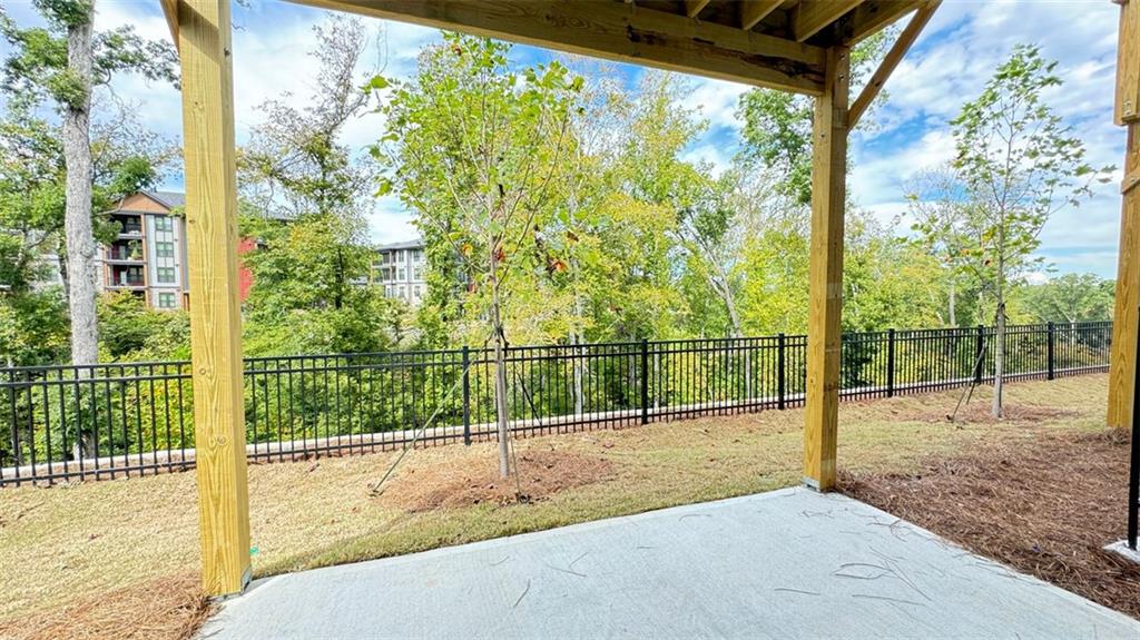 1479 Creekside Circle Northwest Atlanta, GA 30318 - Photo 33 of 42 a view of a yard and deck