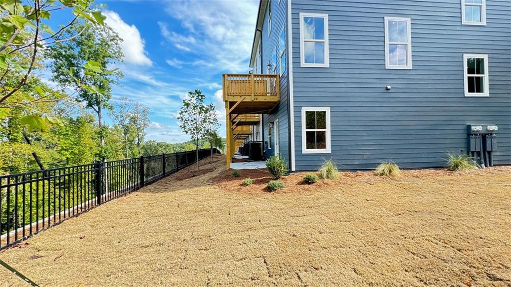 1479 Creekside Circle Northwest Atlanta, GA 30318 - Photo 34 of 42 a view of a brick house with a yard