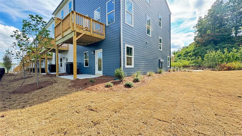 1479 Creekside Circle Northwest Atlanta, GA 30318 - Photo 35 of 42 a view of a house with a patio