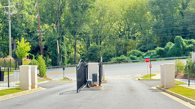 a view of a yard with a house in the background