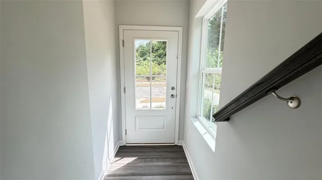 a view of a hallway with windows