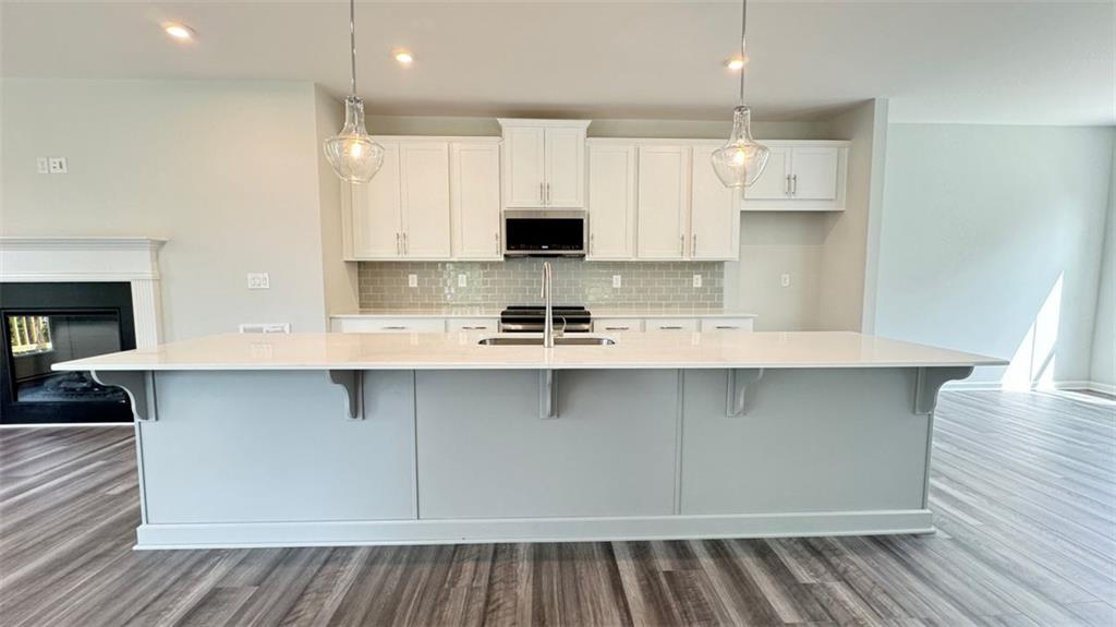 1479 Creekside Circle Northwest Atlanta, GA 30318 - Photo 6 of 42 a kitchen with a sink stainless steel appliances and cabinets