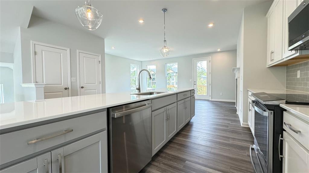1479 Creekside Circle Northwest Atlanta, GA 30318 - Photo 8 of 42 a large kitchen with cabinets