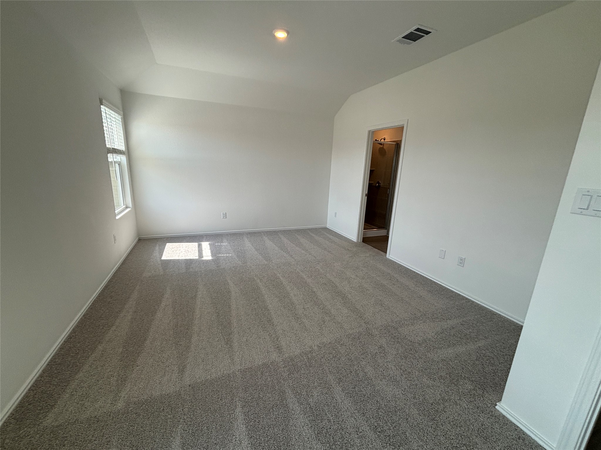 3262 Everett Kyle, TX 78640 - Photo 16 of 24 Carpeted empty room featuring vaulted ceiling and recessed lighting