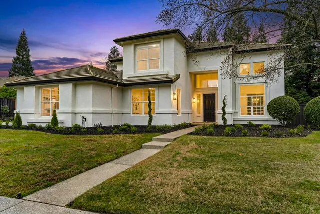 a front view of a house with a yard