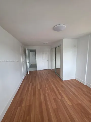 a bathroom with a double vanity sink toilet and shower