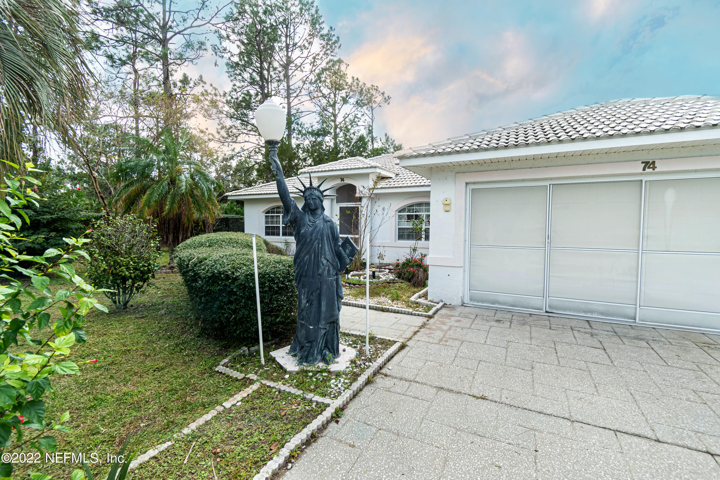 74 Raintree Place Palm Coast, FL 32164 - Photo 2 of 51 frontyard10