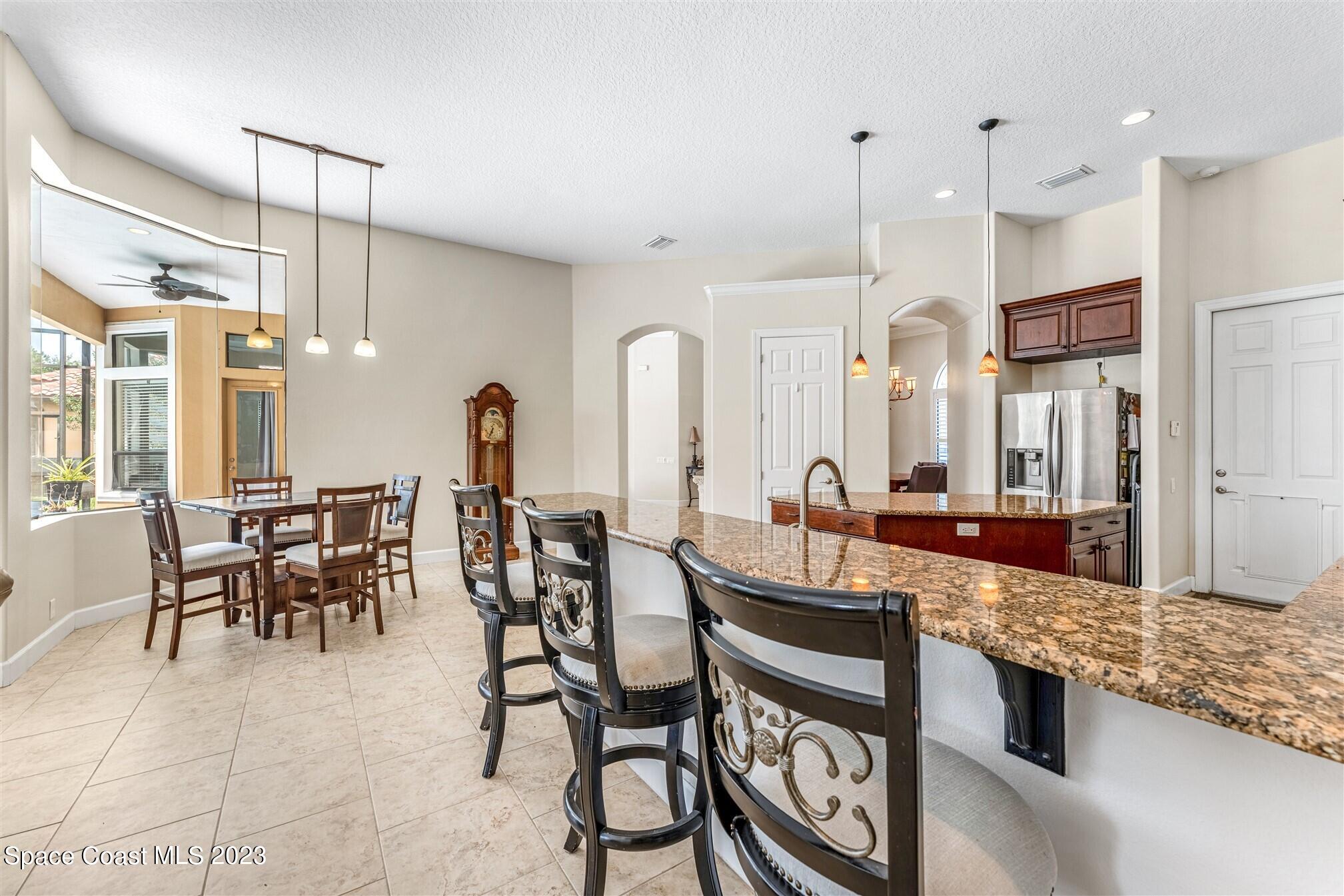 3550 Thurloe Drive Rockledge, FL 32955 - Photo 16 of 44 a large kitchen with a table and chairs