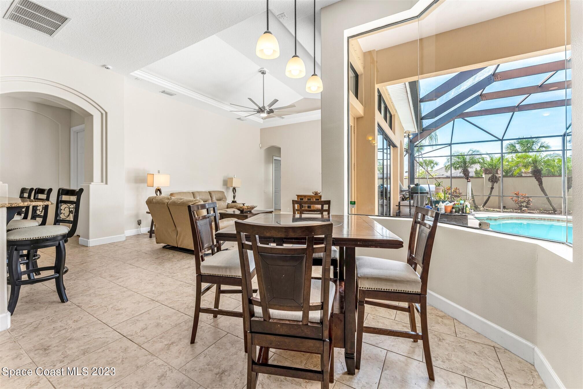 3550 Thurloe Drive Rockledge, FL 32955 - Photo 17 of 44 a view of a dining room with furniture window and outside view