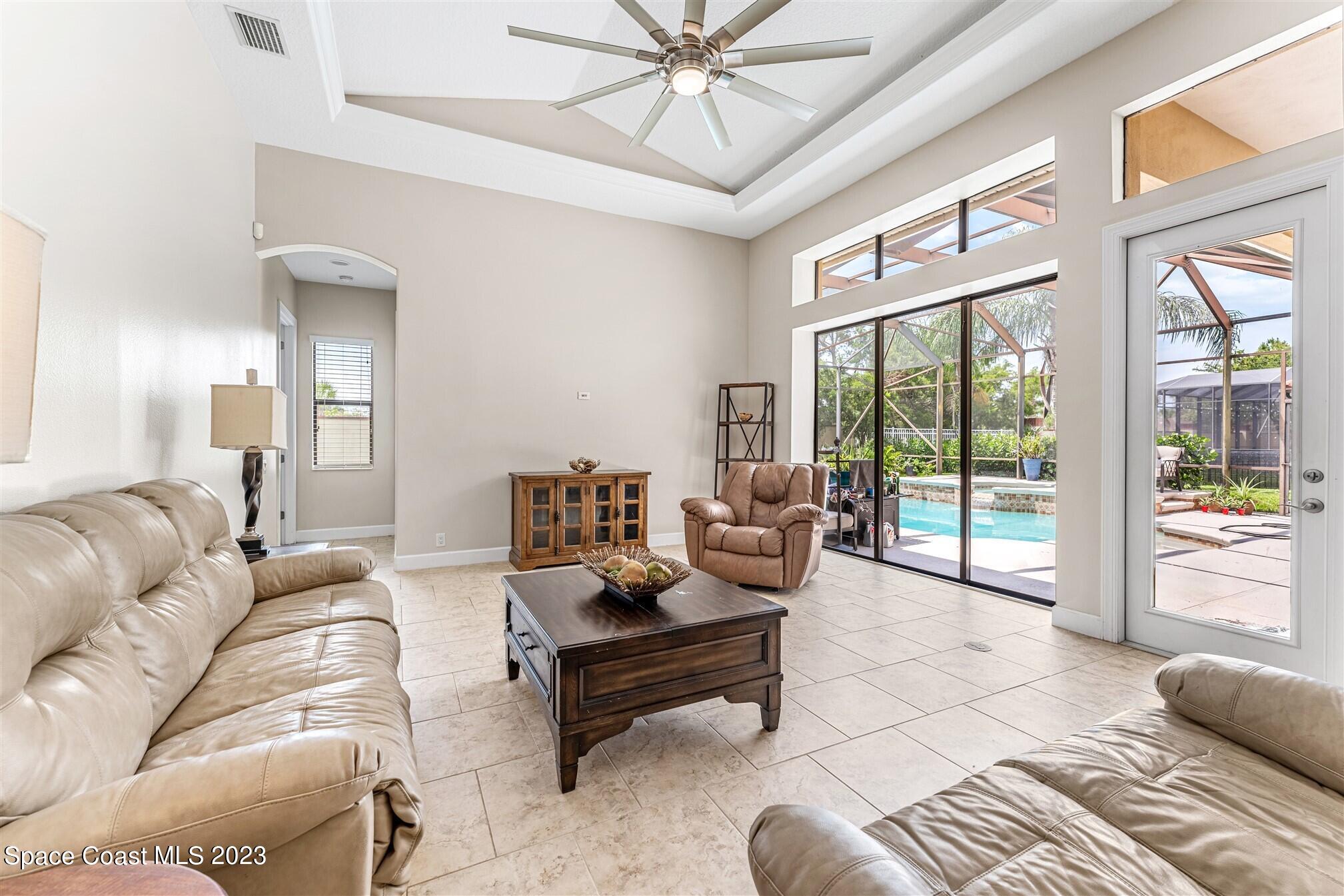 3550 Thurloe Drive Rockledge, FL 32955 - Photo 19 of 44 a living room with furniture and a large window with balcony view