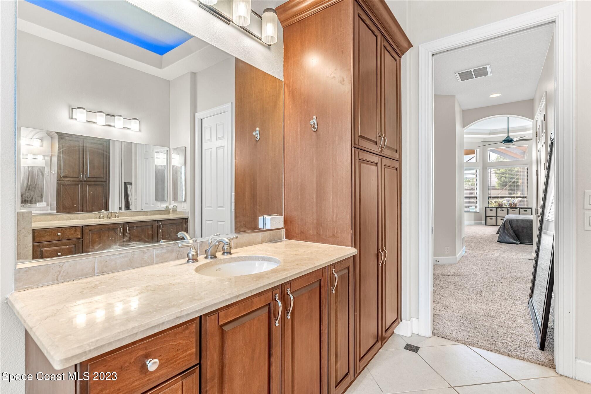 3550 Thurloe Drive Rockledge, FL 32955 - Photo 25 of 44 a bathroom with a sink and a mirror