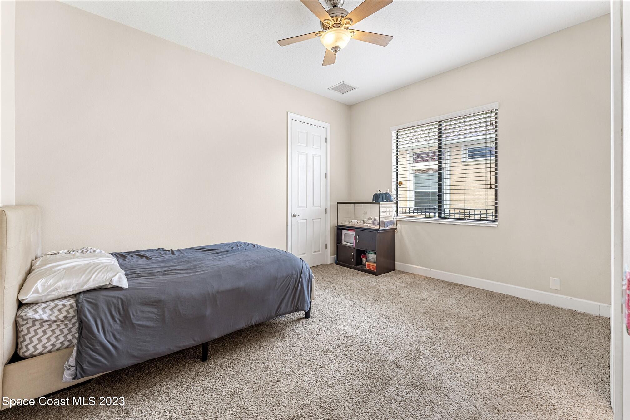 3550 Thurloe Drive Rockledge, FL 32955 - Photo 26 of 44 a living room with a bed furniture and decor