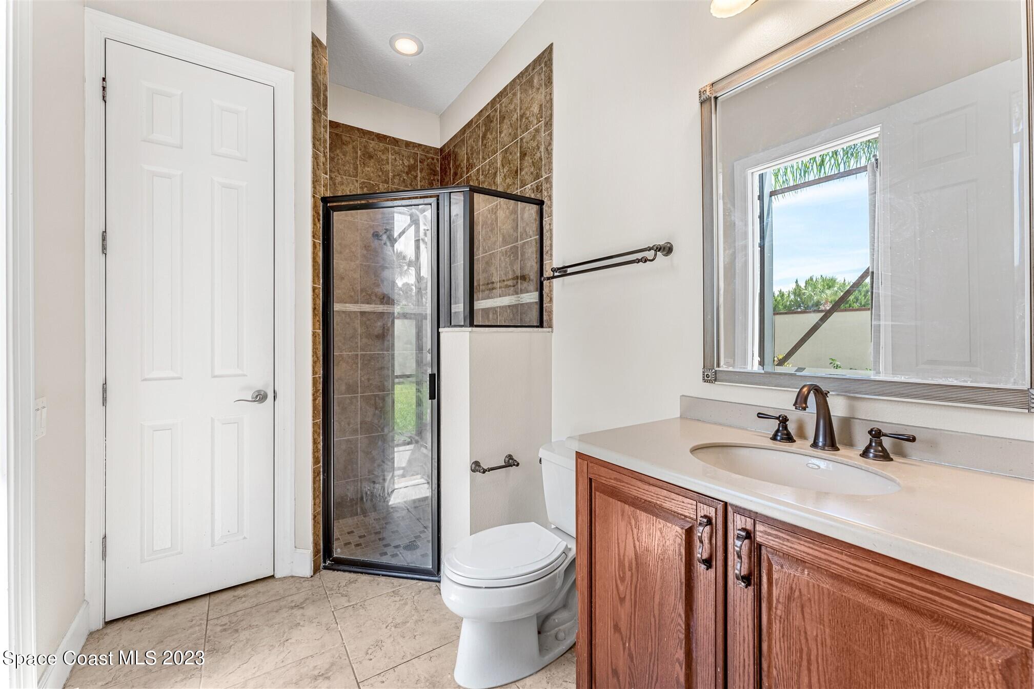 3550 Thurloe Drive Rockledge, FL 32955 - Photo 30 of 44 a bathroom with a sink toilet and shower