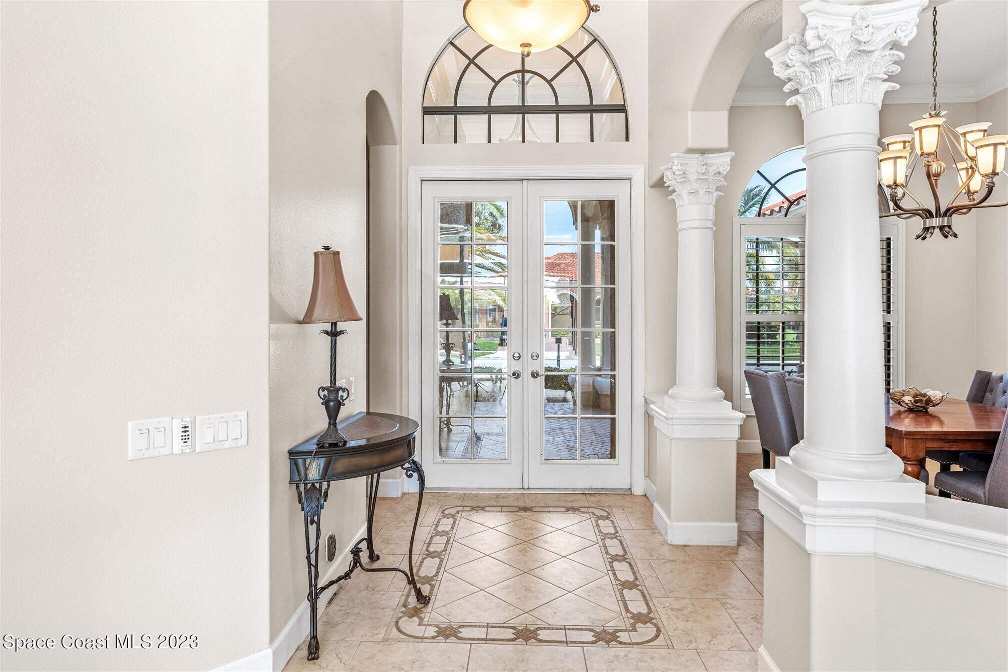3550 Thurloe Drive Rockledge, FL 32955 - Photo 3 of 44 a view of hall way with furniture and large windows