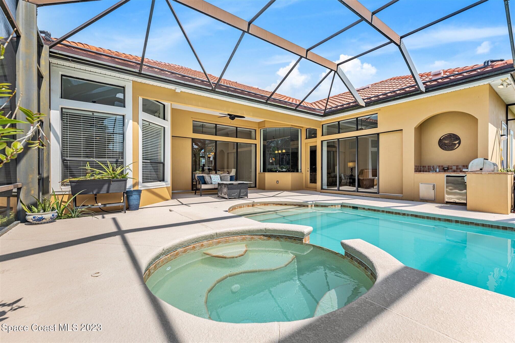 3550 Thurloe Drive Rockledge, FL 32955 - Photo 34 of 44 a view of swimming pool with a couches chairs and plants