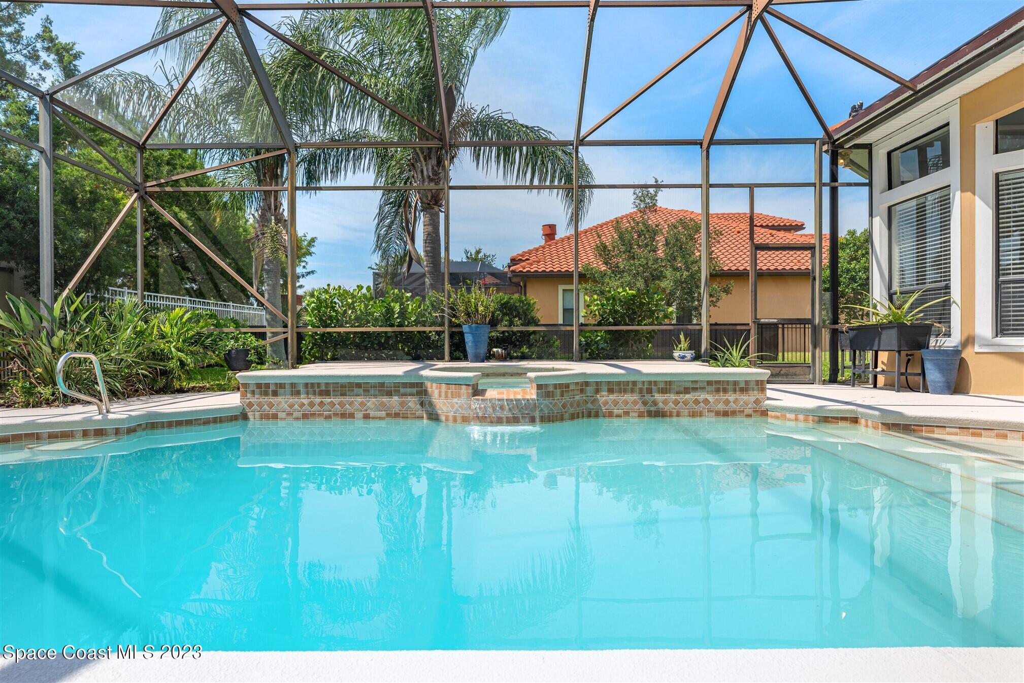 3550 Thurloe Drive Rockledge, FL 32955 - Photo 36 of 44 a swimming pool with outdoor seating and yard