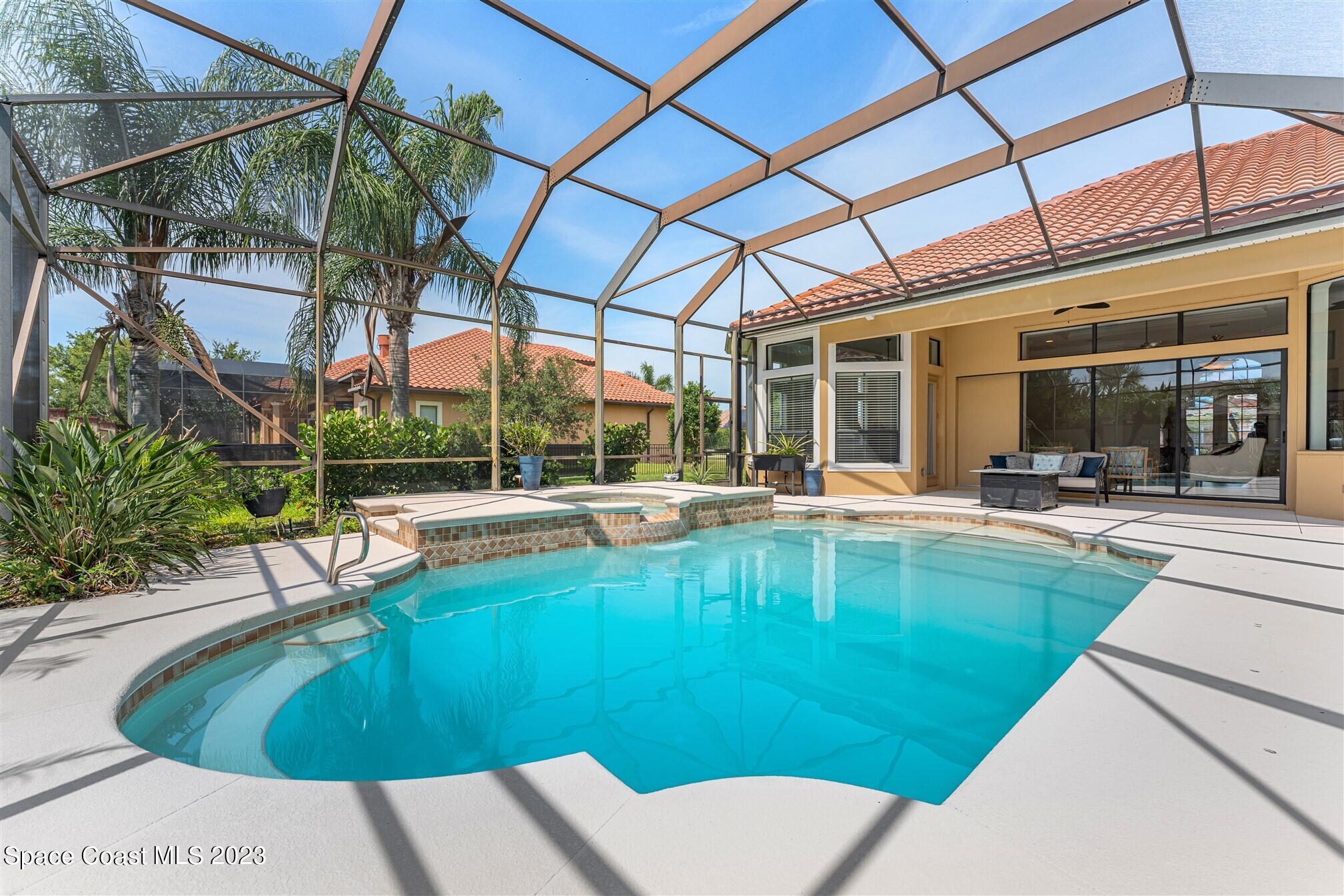 3550 Thurloe Drive Rockledge, FL 32955 - Photo 37 of 44 a view of a swimming pool with a patio
