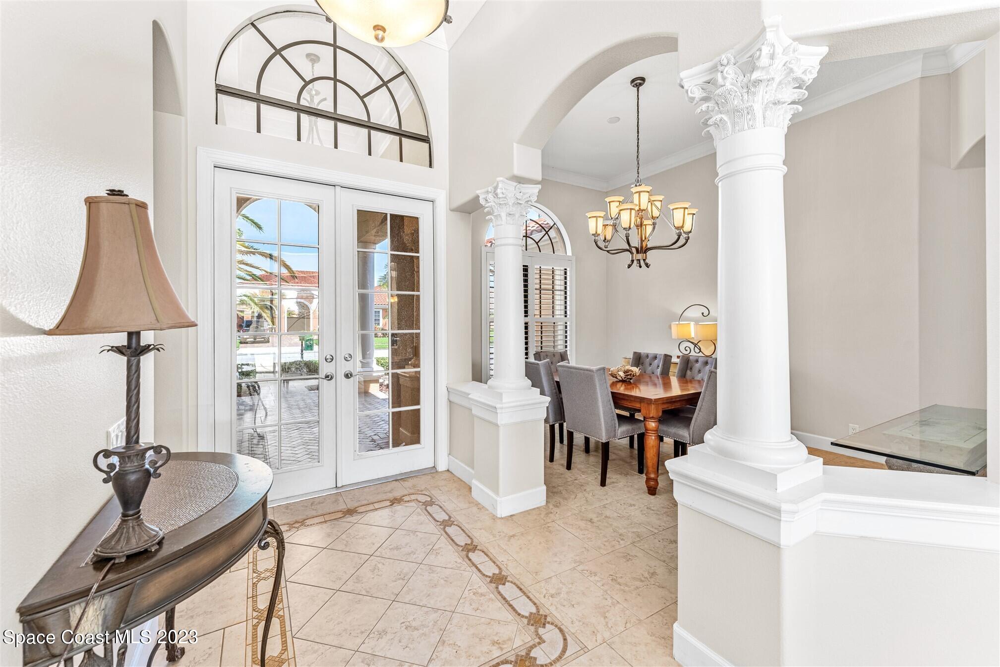 3550 Thurloe Drive Rockledge, FL 32955 - Photo 4 of 44 a living room with furniture a chandelier and a table