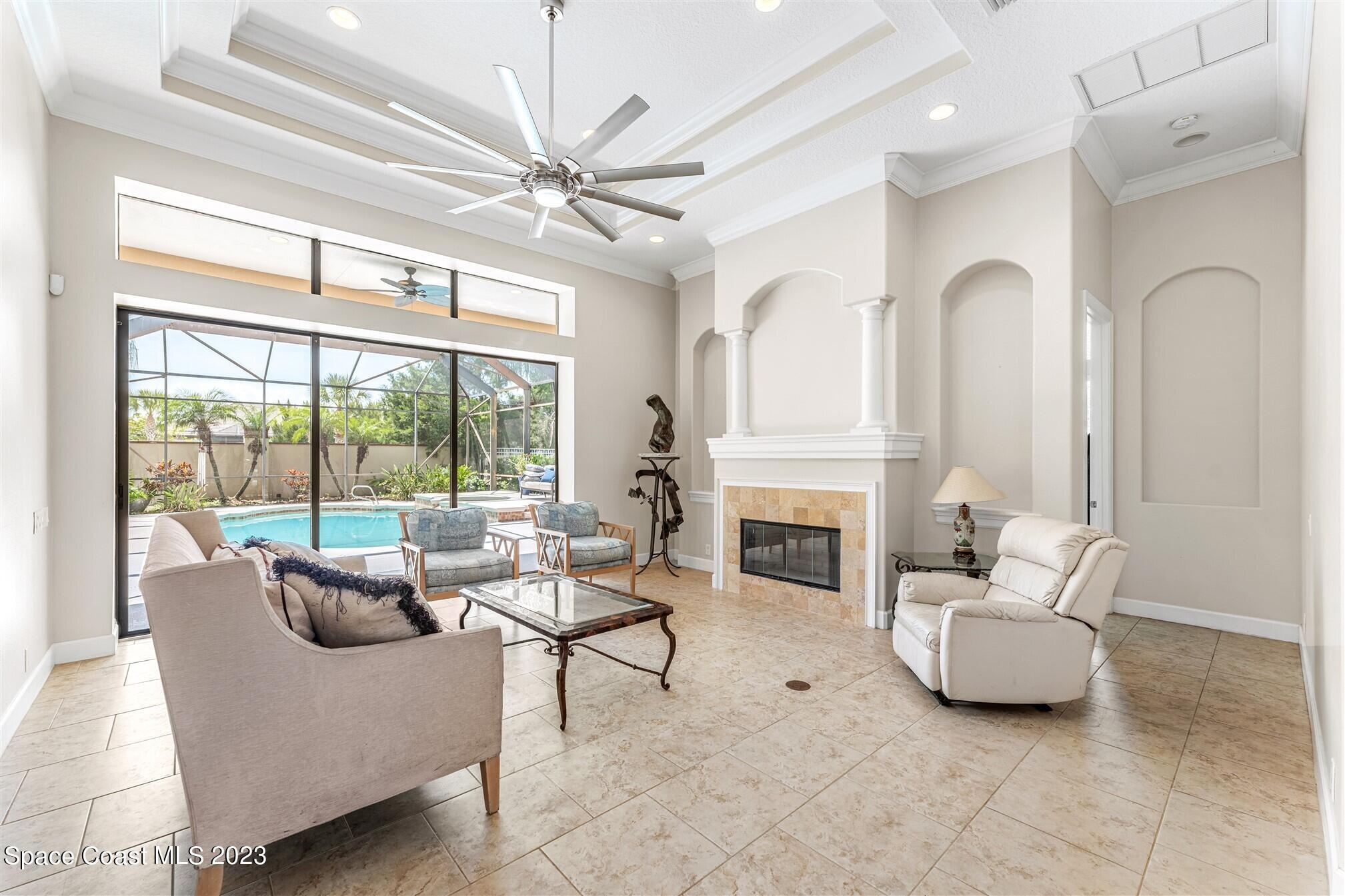 3550 Thurloe Drive Rockledge, FL 32955 - Photo 8 of 44 a living room with furniture and a fireplace