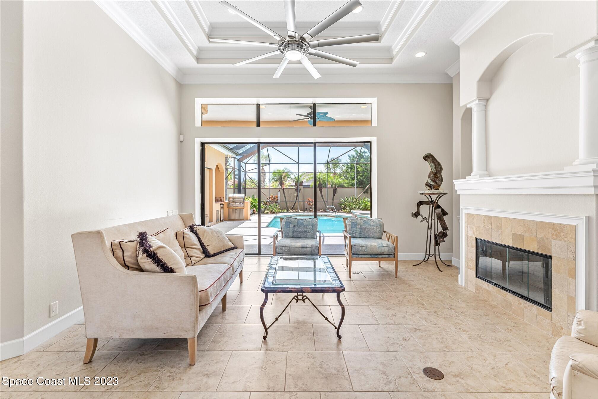 3550 Thurloe Drive Rockledge, FL 32955 - Photo 9 of 44 a living room with furniture and a fireplace