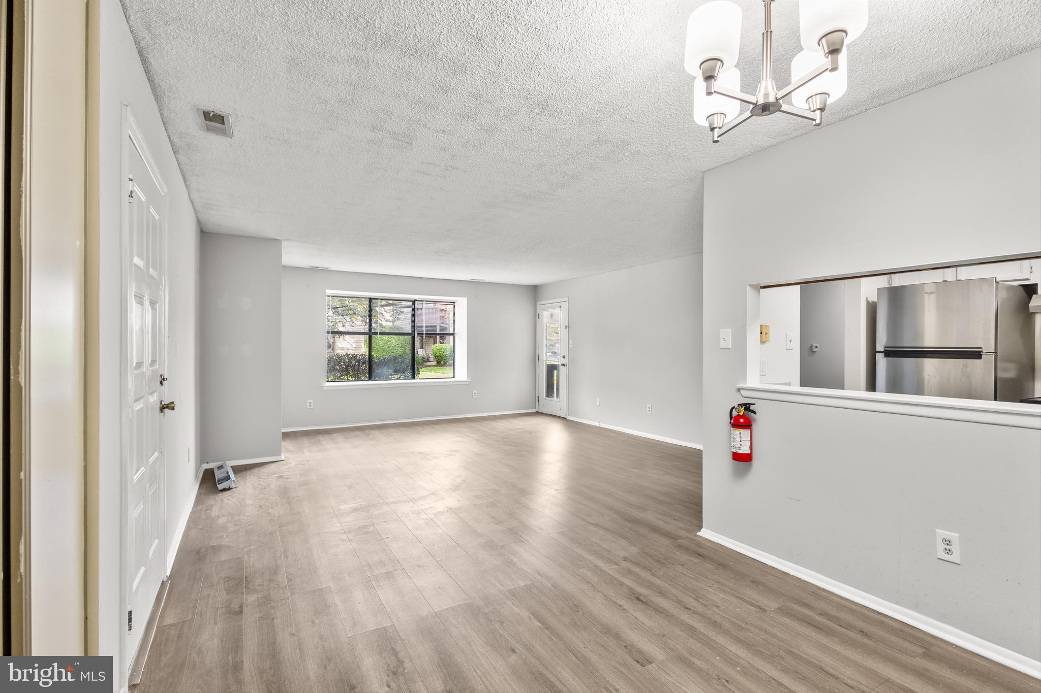 4901A Dunbarton Road Mount Laurel, NJ 08054 - Photo 3 of 12 wooden floor in an empty room with a window