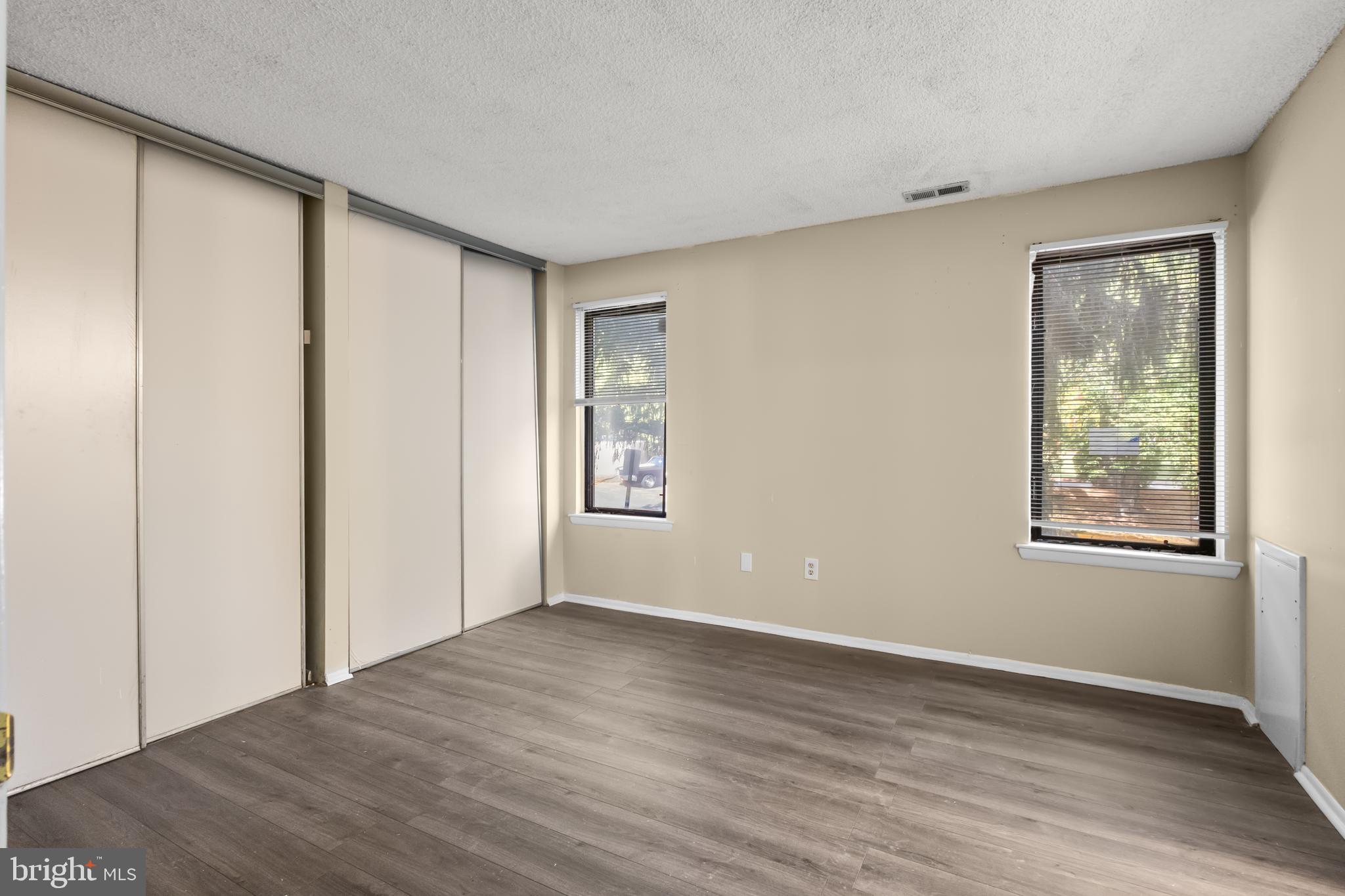 4901A Dunbarton Road Mount Laurel, NJ 08054 - Photo 5 of 12 a view of an empty room with wooden floor and a window