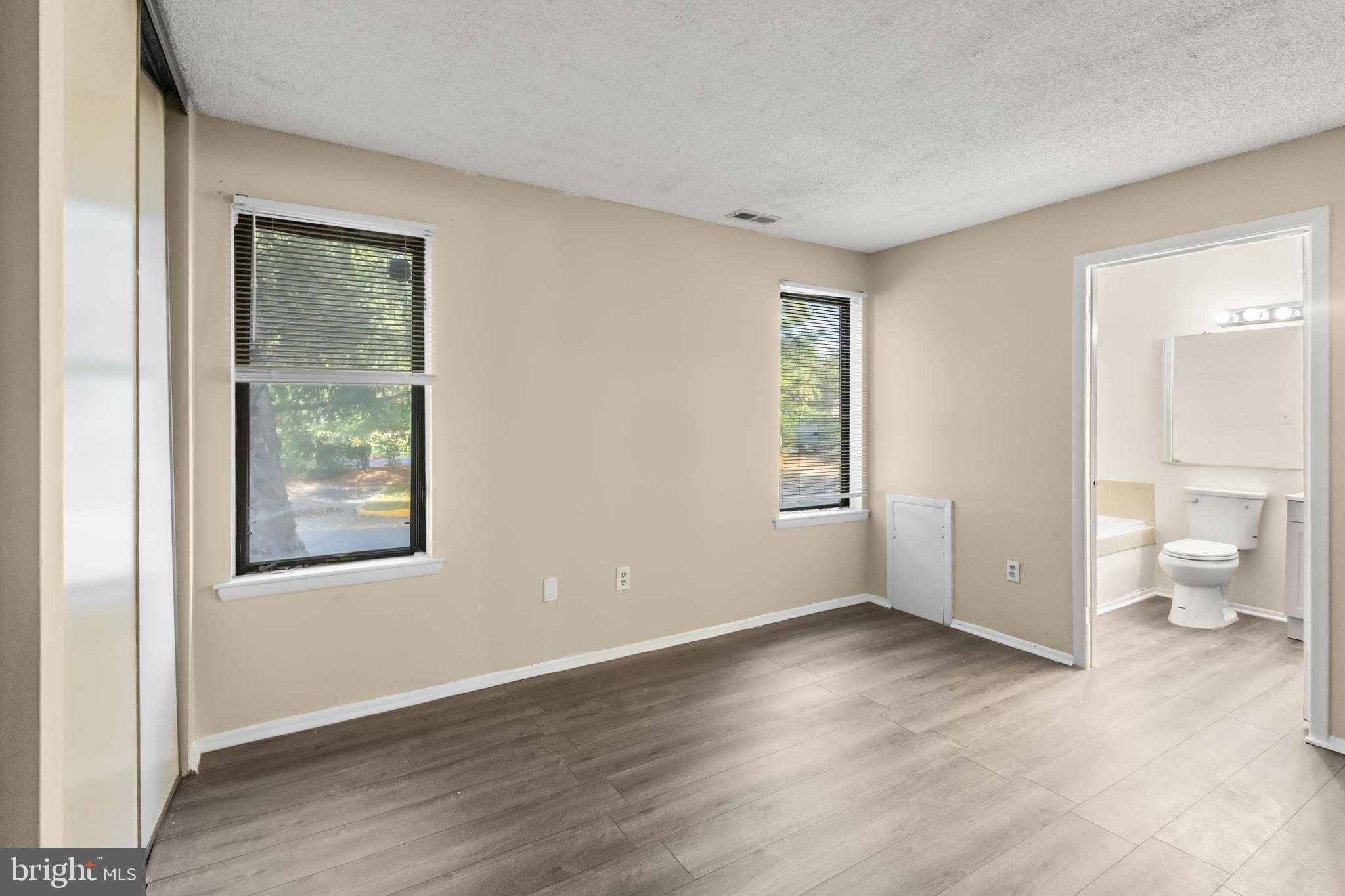 4901A Dunbarton Road Mount Laurel, NJ 08054 - Photo 8 of 12 a view of an empty room with glass door and wooden floor
