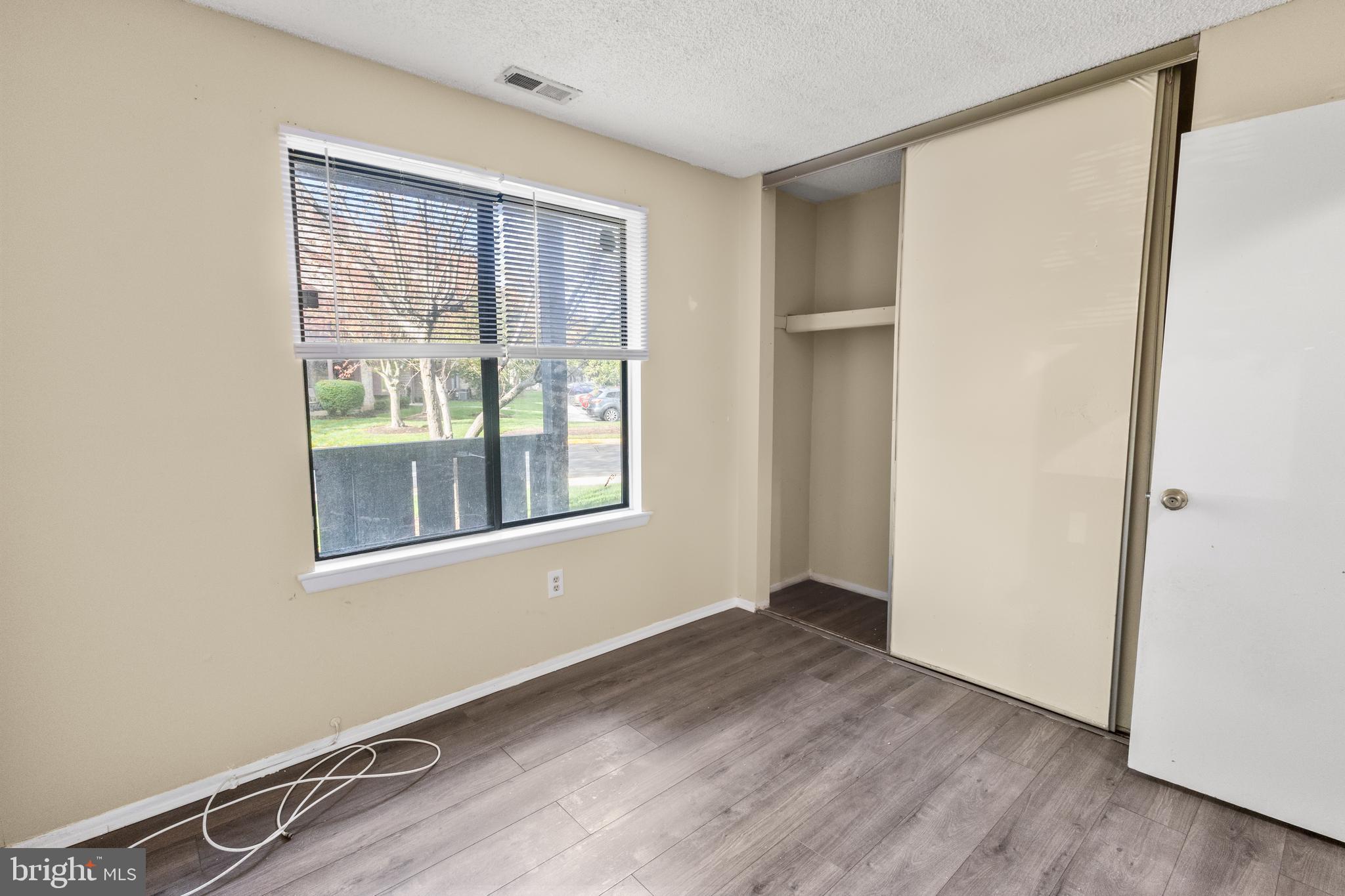 4901A Dunbarton Road Mount Laurel, NJ 08054 - Photo 10 of 12 an empty room with wooden floor and windows