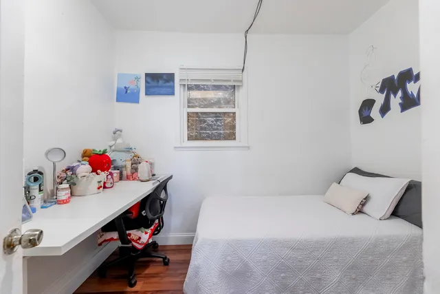 a bedroom with a bed and cabinets