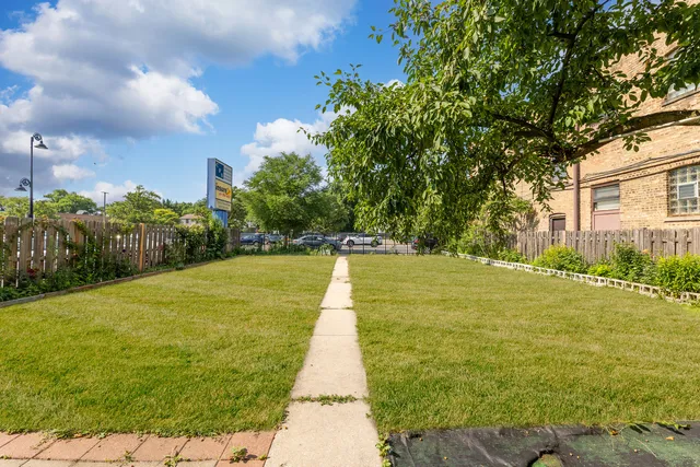 a view of a backyard with sitting area