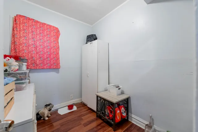 a room with furniture and wooden floor