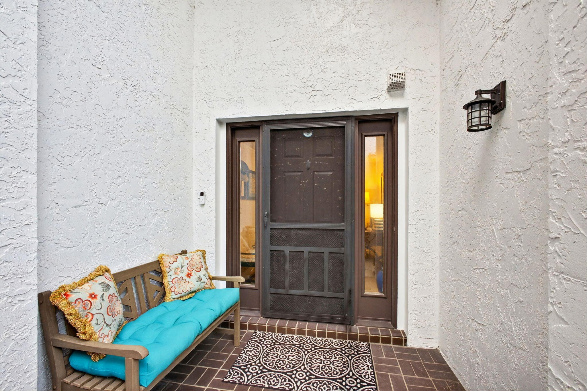 a living room with a couch and a rug