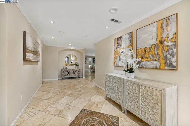 a spacious bedroom with a large bed and a window