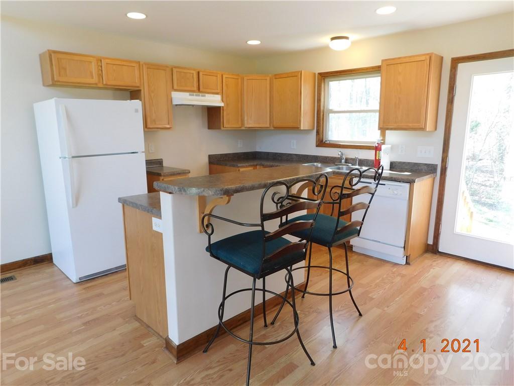 5612 Stack Road Monroe, NC 28112 - Photo 7 of 14 a table and chairs in a kitchen with a window