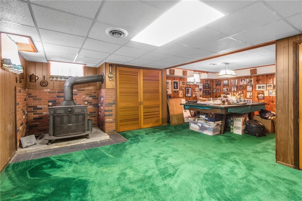2265 Brodhead Road Aliquippa, PA 15001 - Photo 20 of 25 Basement area is fully finished with a log burner and if you are a pool/ping pong player - the table stays!