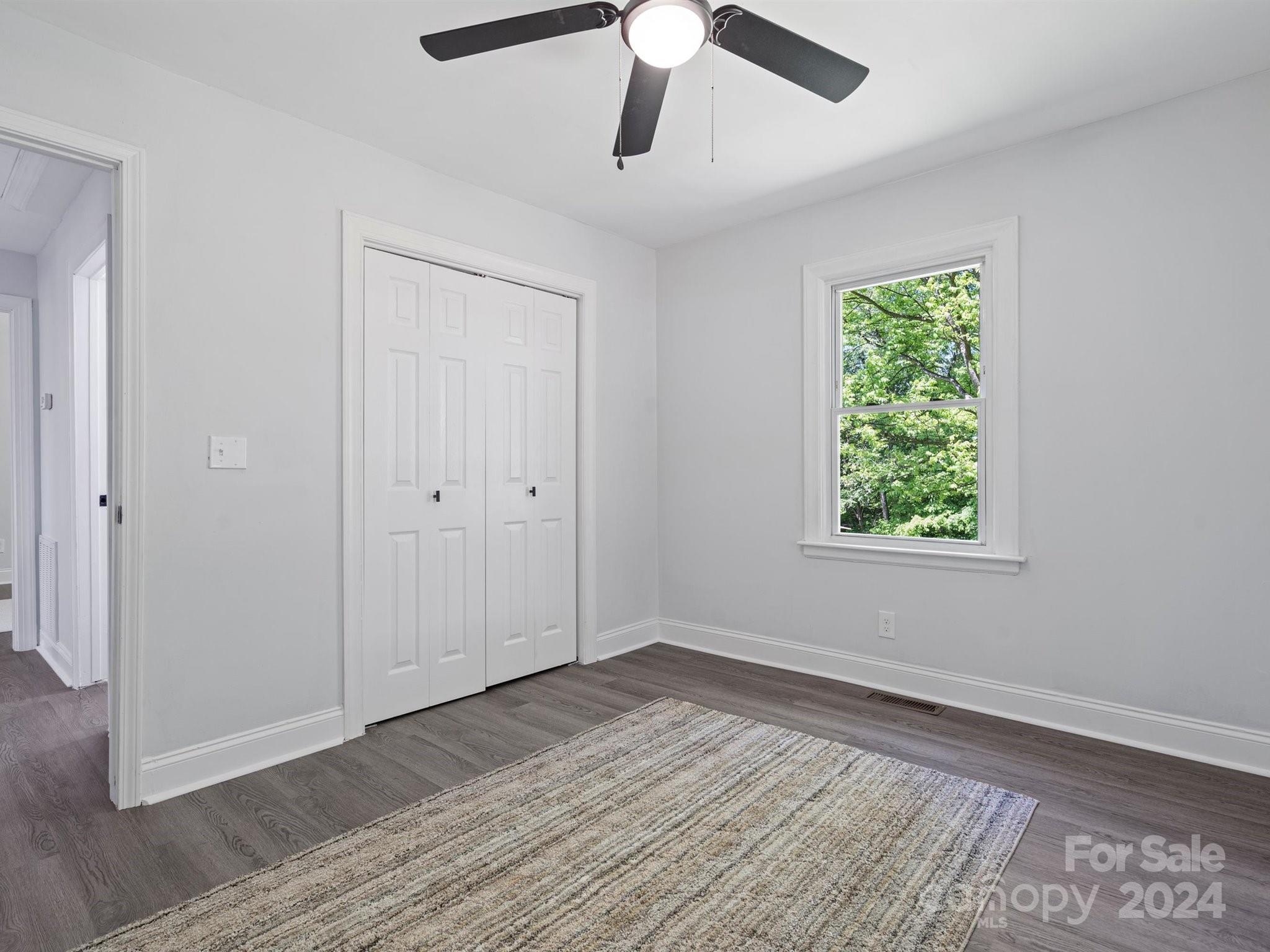 640 Summerow Road Stanley, NC 28164 - Photo 31 of 38 a view of an empty room with wooden floor and a window