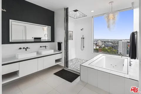 a bathroom with a bathtub and a sink