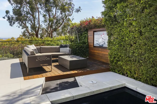 a terrace of a house with outdoor seating