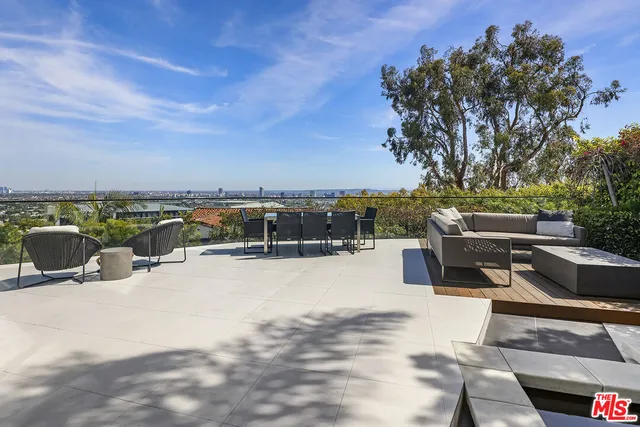a view of a terrace with sitting area