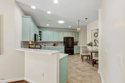 a kitchen with a sink stove and microwave