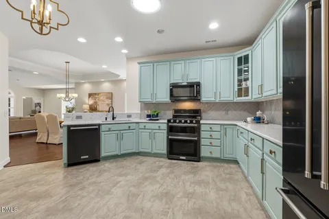 a bedroom with a bed and a lamp on dresser