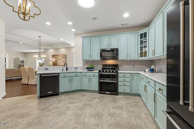 a bedroom with a bed and a lamp on dresser