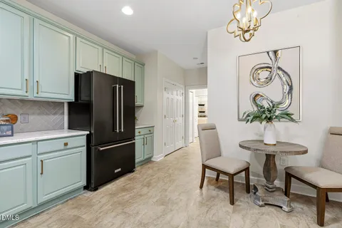 a bedroom with a bed and painting on the wall