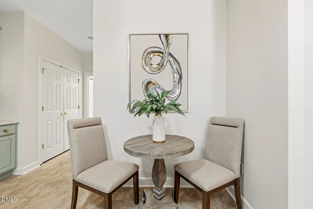 a bedroom with a bed and a chandelier fan