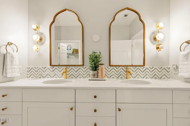 a couple of flower plants in front of house