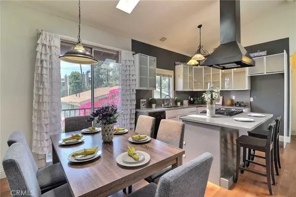 a kitchen with a table and chairs in it